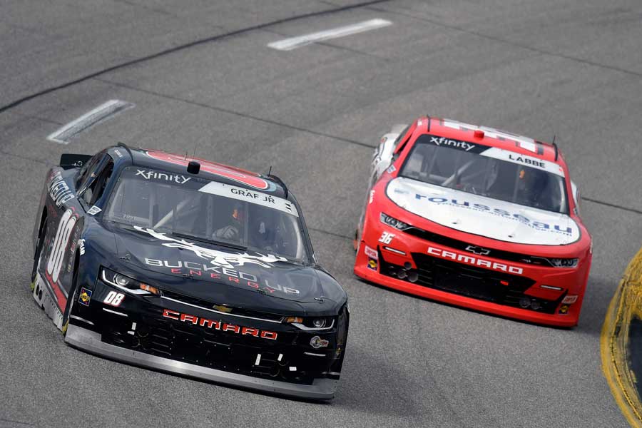 Photo of 2 race cars on a race track