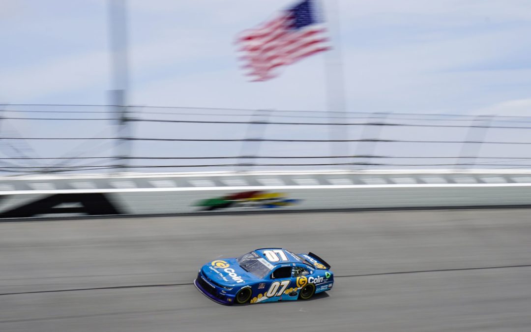 #07 race car racing on track with American flag in background