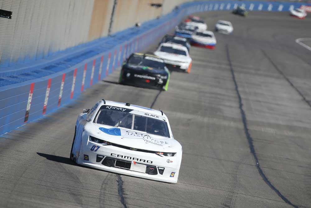 NASCAR Xfinity Driver 07 Ray Black Jr racing on Auto Club Speedway track in the Production Alliance Group 300 race